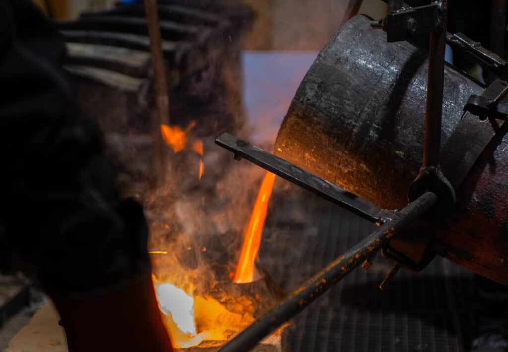 Pouring molten metal into moulds