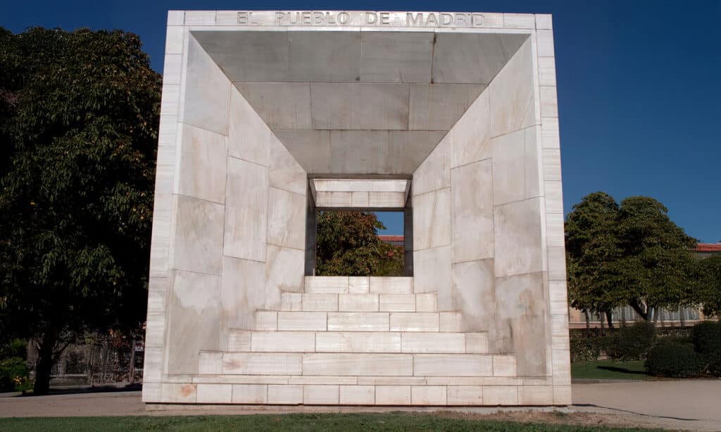 Front view of the Monument to the 1978 Constitution in Madrid, a public marble sculpture located in Plaza de Roma.<br>