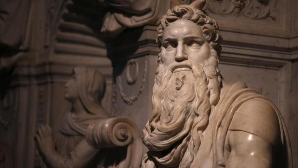 Close-up of Michelangelo's Moses with intense expression and symbolic horns