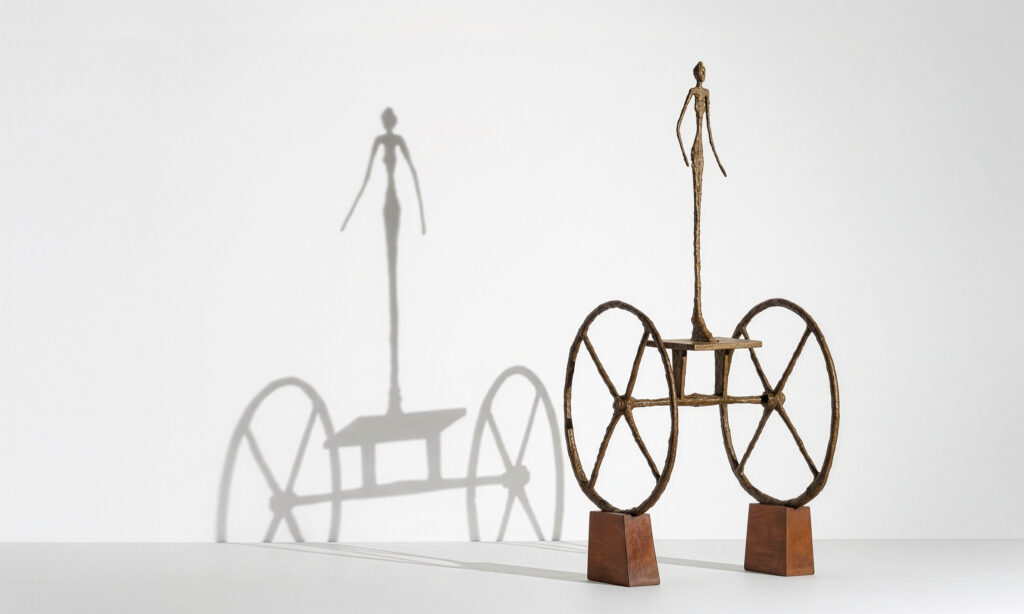 Chariot de Alberto Giacometti, figura femenina de bronce sobre un carro