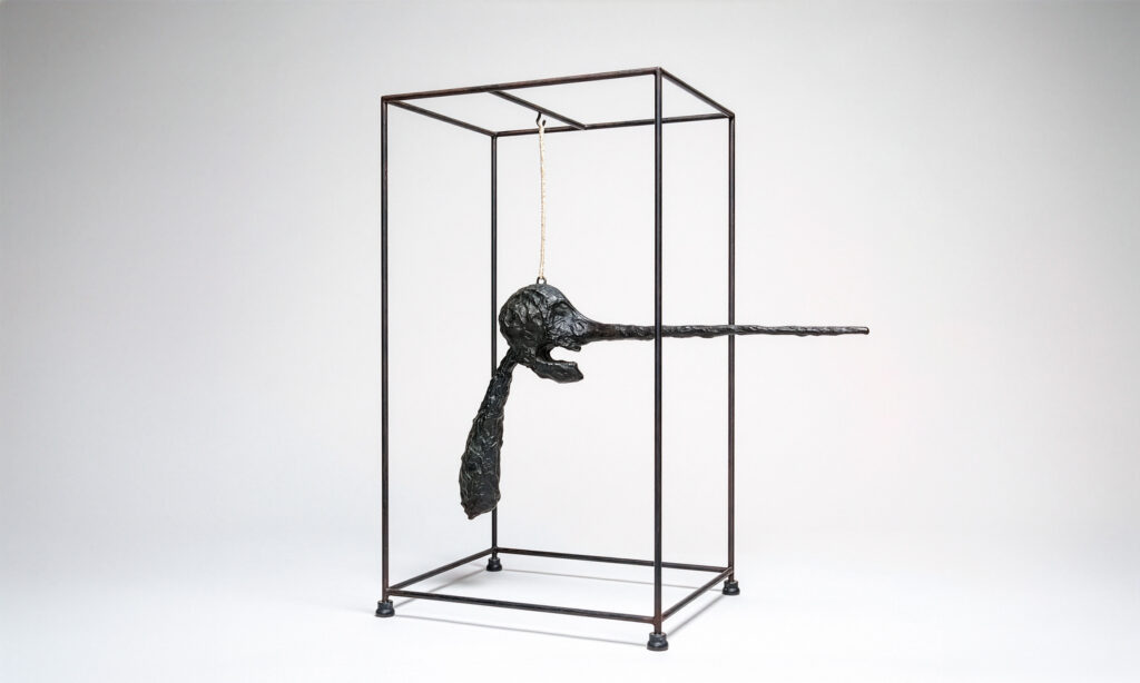 Le Nez de Alberto Giacometti, cabeza suspendida en una jaula metálica