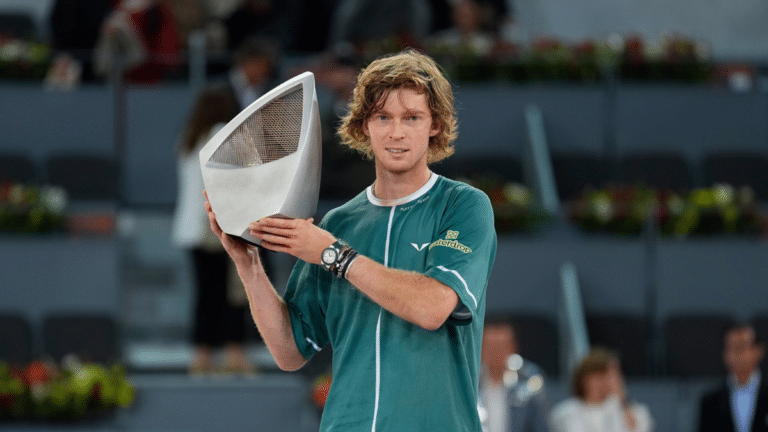 Rublev lifting his trophy