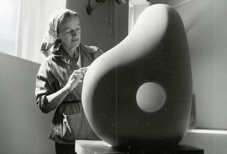 Vintage photograph of Barbara Hepworth sculpting in her workshop.