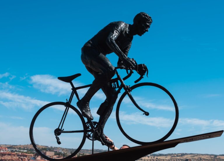 Bronze sculpture of Federico Martín Bahamontes riding his bicycle.