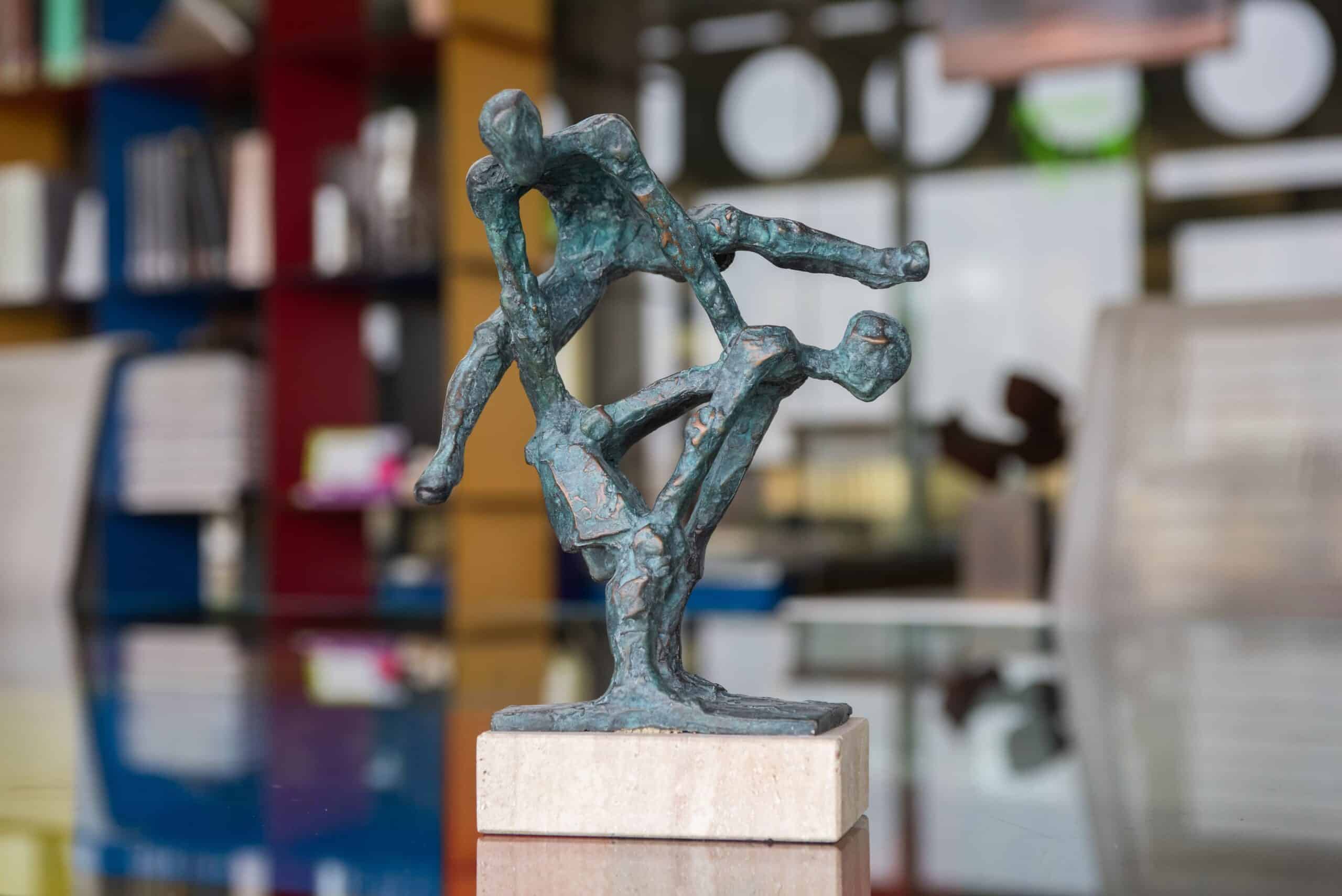 Modern bronze sculpture with textured finish and marble base, created by Capa Esculturas, located in our art gallery.